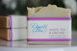 A White Tea and Orchid soap with two White Tea and Orchid soaps behind it