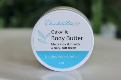Elemental Blue Oakville Body Butter enriched with kukui oil, a moisturizing body butter with an elegant fragrance inspired by aged wine, florals, and vanilla.
